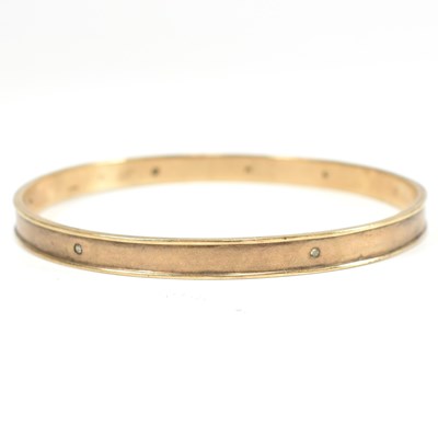 Lot 124 - HALLMARKED 9CT GOLD & DIAMOND BANGLE