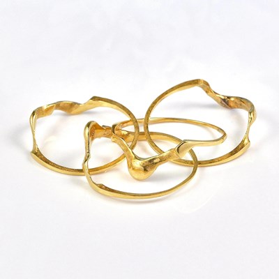 Lot 542 - A VINTAGE 4-PIECE PUZZLE RING
