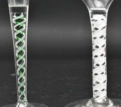 Lot 97 - TWO GEORGE II / III OPAQUE TWIST STEM WINE GLASSES