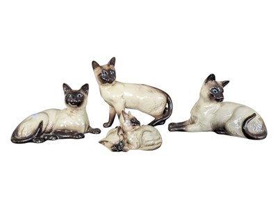 Lot 59 - BESWICK - COLLECTION OF FOUR POTTERY CERAMIC SIAMESE CATS