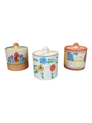 Lot 198 - TWO 1930S CLARICE CLIFF BIZARRE PATTERN LIDDED POTS & ANOTHER EXAMPLE