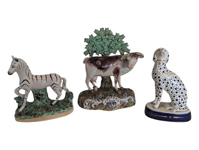 Lot 133 - THREE 19TH CENTURY STAFFORDSHIRE PORCELAIN ANIMAL FIGURES