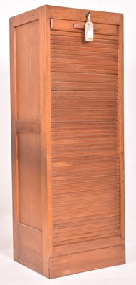 Lot 235 - A MID CENTURY FRENCH OAK TAMBOUR FRONTED FILING CABINET WITH KEY