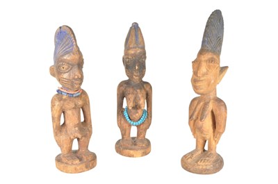 Lot 393 - THREE 20TH CENTURY NIGERIAN IBEJI WOODEN FIGURES