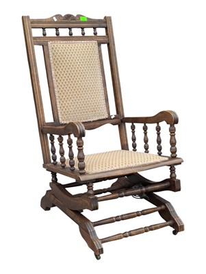 Lot 688 - EDWARDIAN MAHOGANY AMERICAN ROCKING ARMCHAIR