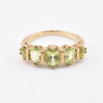 Lot 358 - HALLMARKED 9CT GOLD & PERIDOT FIVE STONE RING
