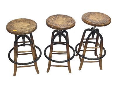 Lot 853 - SET OF INDUSTRIAL CAST METAL & ELM WOOD SWIVEL BAR STOOLS