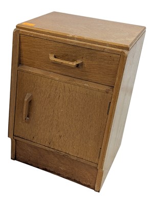 Lot 883 - ERNEST GOMME FOR G-PLAN FURNITURE - PAIR OF OAK BEDSIDE CABINETS