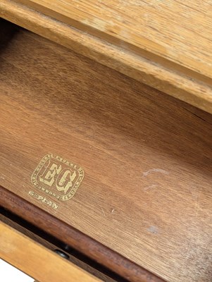 Lot 883 - ERNEST GOMME FOR G-PLAN FURNITURE - PAIR OF OAK BEDSIDE CABINETS