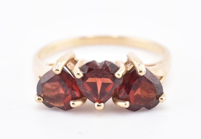 Lot 447 - HALLMARKED 9CT GOLD MOZAMBIQUE GARNET THREE STONE RING