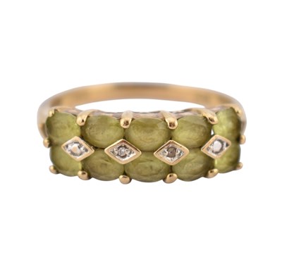 Lot 213 - 9CT GOLD & PERIDOT & DIAMOND 14 STONE RING