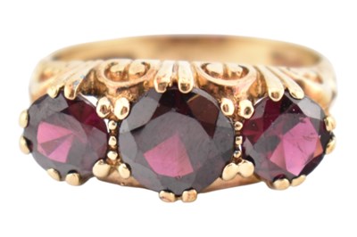 Lot 248 - HALLMARKED 9CT GOLD THREE STONE GARNET RING