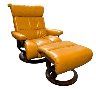 Lot 378 - EKORNES - STTESSLESS - 20TH CENTURY EASY LOUNGE ARMCHAIR WITH STOOL