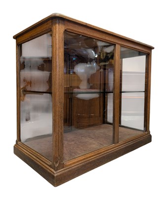 Lot 40 - LATE 19TH / EARLY 20TH CENTURY OAK & GLASS SHOP CABINET / COUNTER