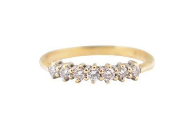 Lot 293 - A HALLMARKED 18CT GOLD & DIAMOND SEVEN STONE RING