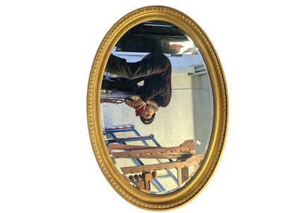 Lot 874 - 20TH CENTURY OVAL GILT FRAMED WALL MIRROR