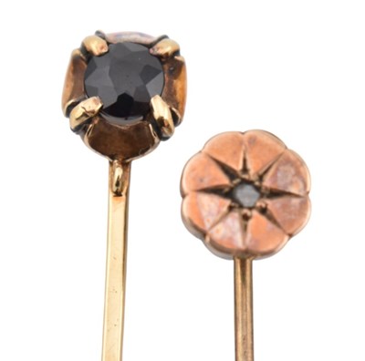 Lot 46 - TWO EARLY 20TH CENTURY YELLOW METAL GEM SET STICK PINS