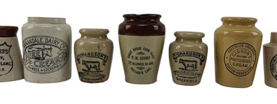 Lot 201 - VINTAGE ADVERTISING. COLLECTION OF FIFTEEN STONEWARE CREAM JUGS, NAMED