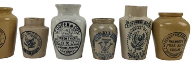 Lot 201 - VINTAGE ADVERTISING. COLLECTION OF FIFTEEN STONEWARE CREAM JUGS, NAMED