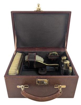 Lot 130 - SMALL 20TH CENTURY CASED LEATHER TRAVELLING VANITY SET