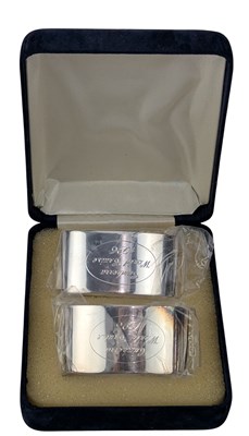 Lot 64 - LATE 20TH CENTURY HALLMARKED SILVER CANBERRA WORLD CRUISE NAPKIN RINGS