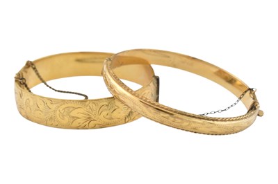 Lot 389 - 2 EARLY 20TH CENTURY ROLLED GOLD BANGLES
