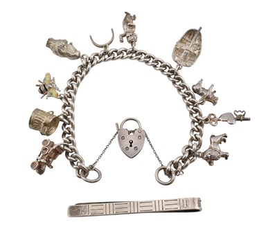 Lot 11 - HALLMARKED SILVER CHARM BRACELET & TIE CLIP