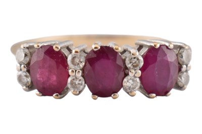 Lot 395 - HALLMARKED 9CT GOLD RUBY & DIAMOND THREE STONE RING