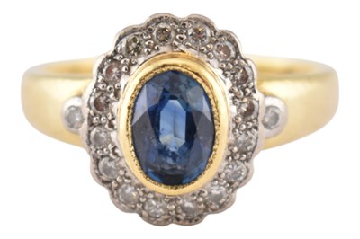 Lot 230 - HALLMARKED 18CT GOLD SAPPHIRE & DIAMOND HALO RING