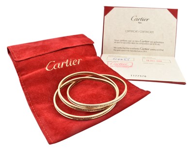 Lot 27 - CARTIER 18CT GOLD & DIAMOND TRINITY BANGLE