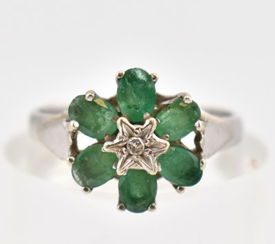 Lot 303 - HALLMARKED 9CT WHITE GOLD EMERALD & DIAMOND CLUSTER RING