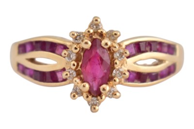 Lot 293 - 14CT GOLD RUBY & DIAMOND HALO RING