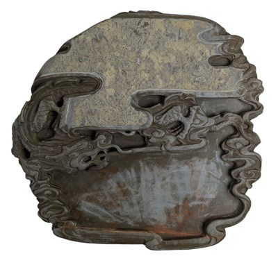 Lot 186 - LARGE CHINESE FOSSIL INKSTONE DECORATED WITH RELIEF DRAGON 三叶虫化石砚台