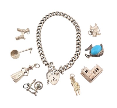Lot 12 - 1970S SILVER CHARM BRACELET & WHITE METAL CHARMS