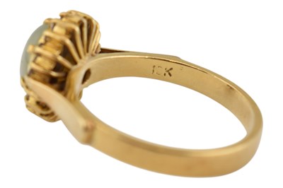 Lot 92 - 18CT GOLD CAT'S EYE CHRYSOBERYL & DIAMOND HALO RING