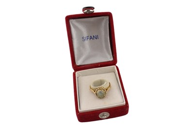 Lot 92 - 18CT GOLD CAT'S EYE CHRYSOBERYL & DIAMOND HALO RING