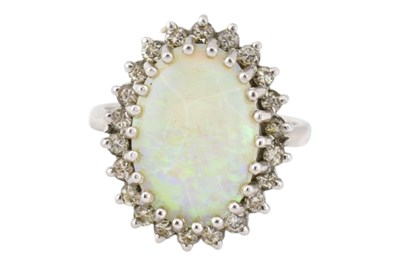 Lot 275 - 1970S HALLMARKED 18CT GOLD OPAL & DIAMOND HALO RING