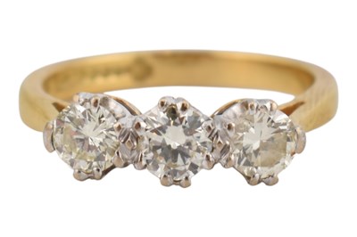 Lot 134 - HALLMARKED 18CT GOLD & DIAMOND THREE STONE RING