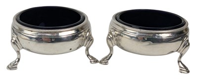 Lot 148 - PAIR OF GEORGE III HALLMARKED SILVER & BLUE GLASS LINED TABLE SALTS