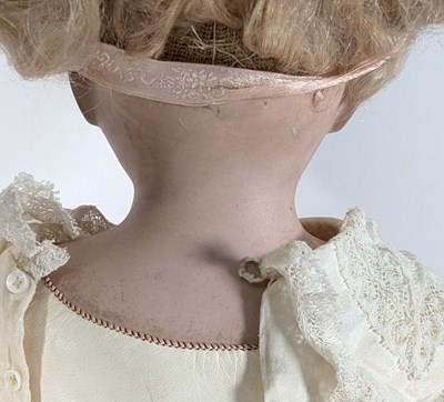 Lot 179 - DOLLS - AN ANTIQUE BISQUE HEADED DOLL WITH PULL STRING VOICE BOX