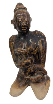 Lot 134 - SMALL BURMESE POTTERY FIGURINE OF A FEMALE FOLDING AN ANIMAL 缅甸陶俑