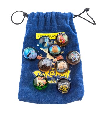 Lot 661 - POKEMON - VINTAGE POKEMON GLASS MARBLES & POUCH