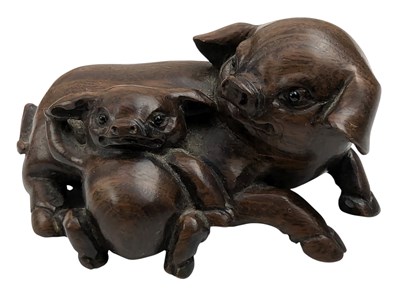 Lot 166 - JAPANESE WOOD CARVED NETSUKE INFORM OF TWO PIGS 日本木刻根付