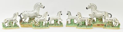 Lot 54 - EIGHT 19TH CENTURY STAFFORDSHIRE HAND PAINTED POTTERY ZEBRAS