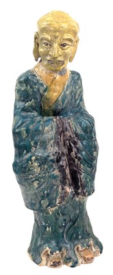 Lot 156 - CHINESE GREEN GLAZED POTTERY FIGURE OF A MONK / LOHAN / ARHAT 素三彩罗汉立像