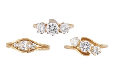 Lot 385 - THREE HALLMARKED 14CT GOLD THREE STONE RINGS