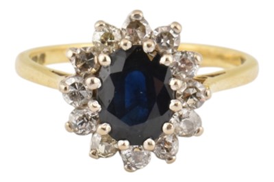Lot 344 - HALLMARKED 18CT GOLD SAPPHIRE & DIAMOND HALO RING