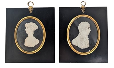 Lot 22 - PAIR OF 19TH CENTURY WATERCOLOUR ON IVORY MINIATURE PORTRAITS OF HUSBAND & WIFE