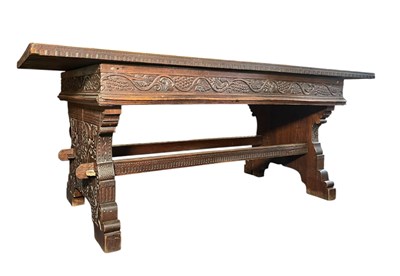 Lot 313 - RENAISSANCE INSPIRED 19TH CENTURY CARVED WALNUT & ELM REFECTORY TABLE