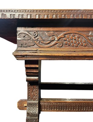 Lot 313 - RENAISSANCE INSPIRED 19TH CENTURY CARVED WALNUT & ELM REFECTORY TABLE
